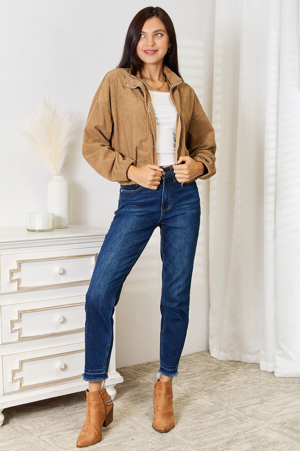 Full outfit with the Fleur camel jacket, blue jeans, and ankle boots